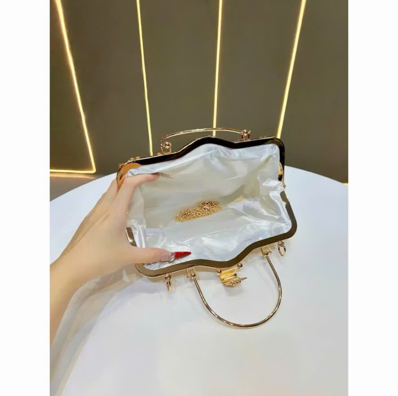 Metallic handbag with stone embellishments