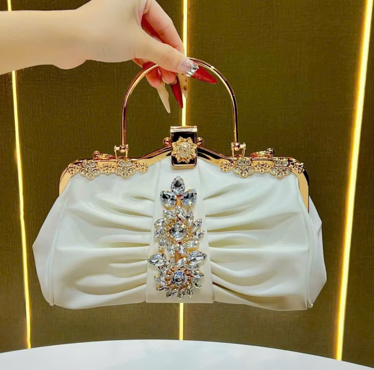Metallic handbag with stone embellishments