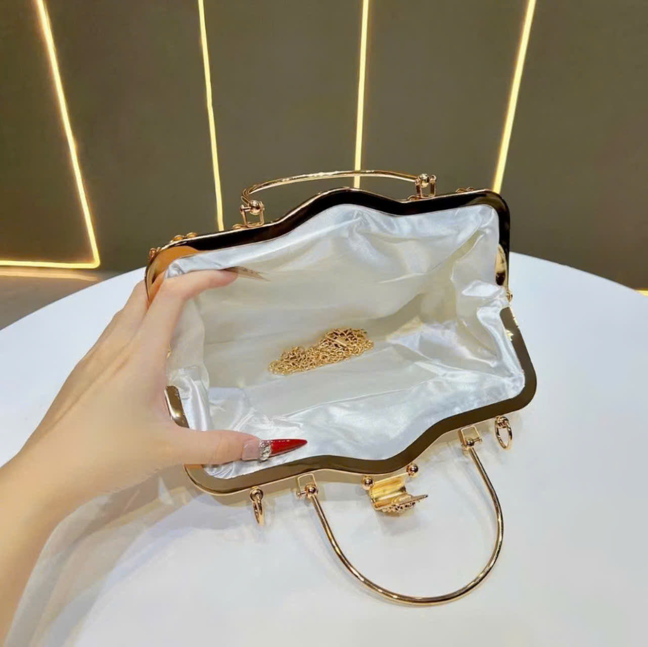 Metallic handbag with stone embellishments