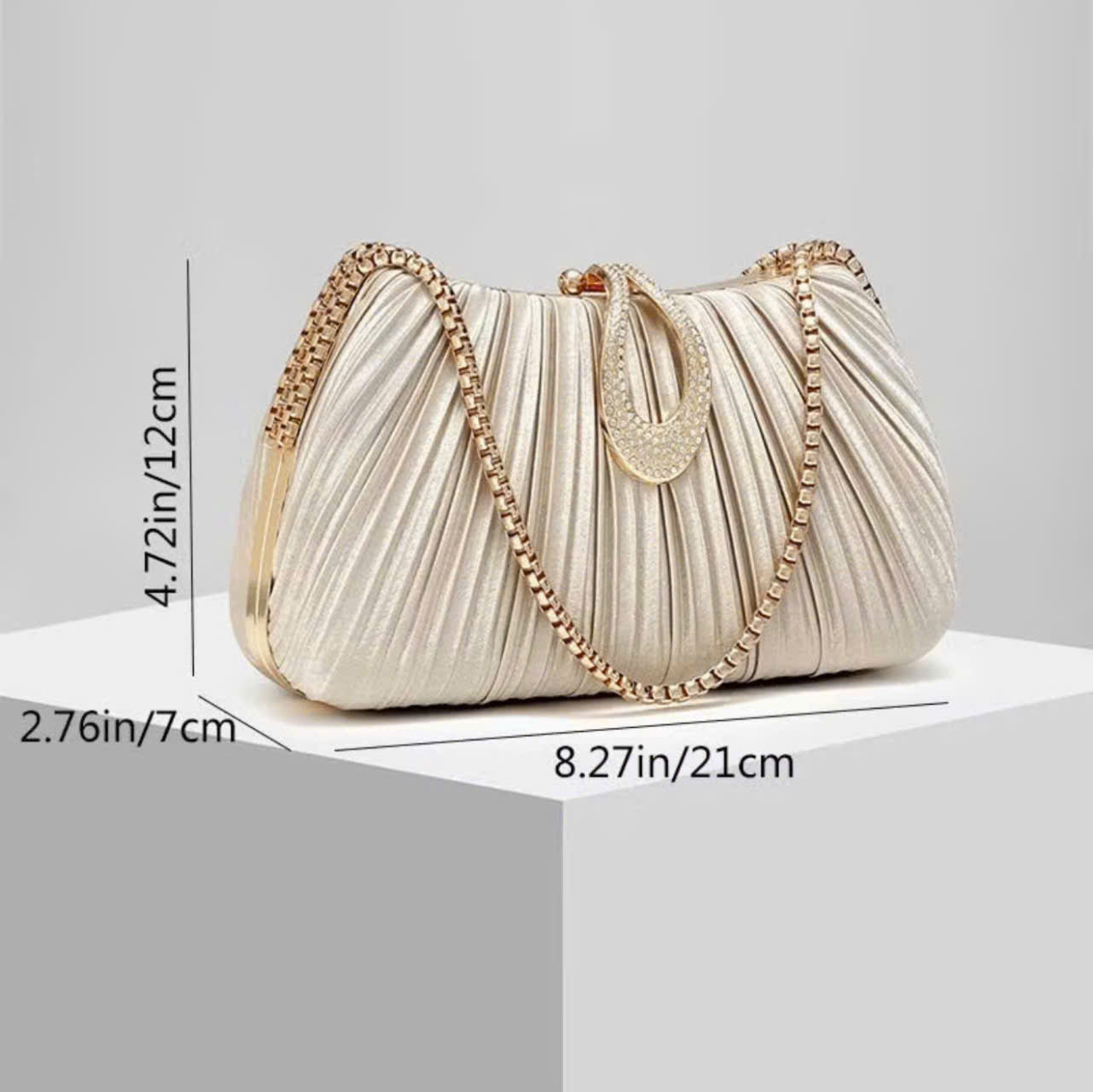 Premium women's party handbag featuring a pleated design and sparkling stone embellishments.