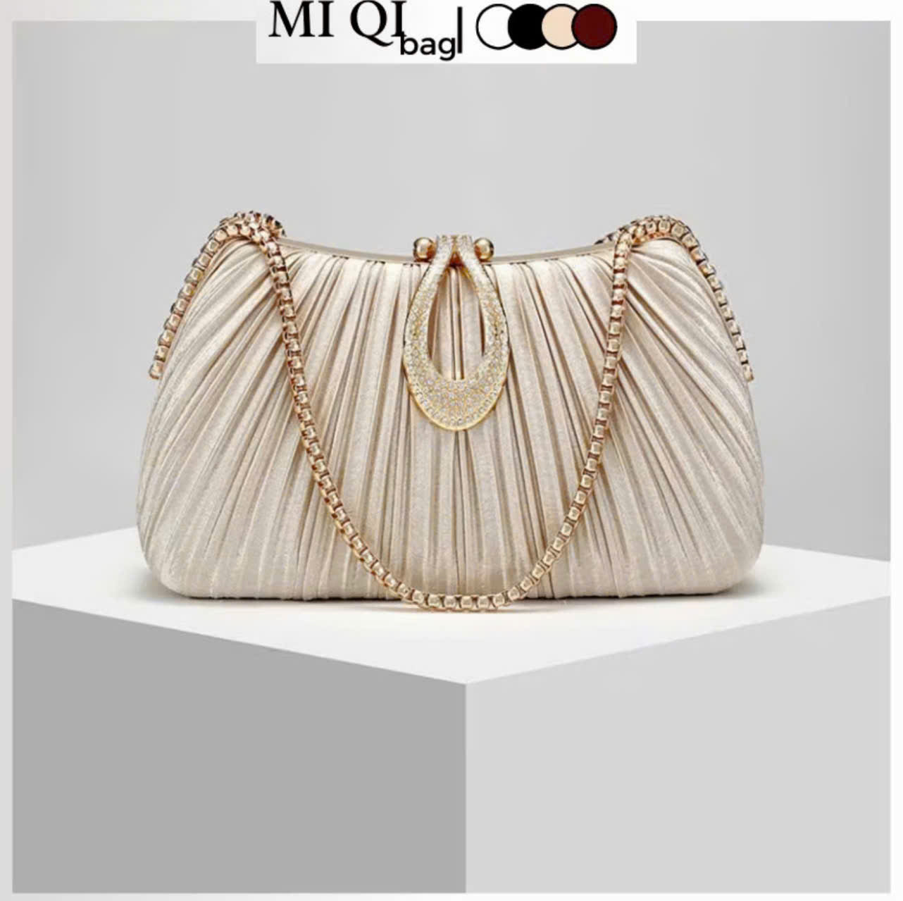 Premium women's party handbag featuring a pleated design and sparkling stone embellishments.